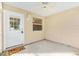 Cozy screened porch with ceiling fan and door leading to the interior at 1052 Ridgeville Rd, The Villages, FL 32162