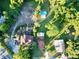 High-angle view of a property with multiple buildings and lush greenery at 104 Sunset Way, Fruitland Park, FL 34731