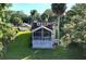 Home features a deck and screened porch overlooking the backyard at 104 Sunset Way, Fruitland Park, FL 34731