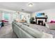 Living room with a fireplace, comfortable seating, and a view of the backyard at 104 Sunset Way, Fruitland Park, FL 34731