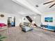 Open concept living room with a sectional sofa, a view of the kitchen and staircase at 104 Sunset Way, Fruitland Park, FL 34731