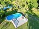 Aerial view of the above ground pool and deck at 104 Sunset Way, Fruitland Park, FL 34731