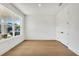 Bright spare bedroom with large window and light wood flooring at 9438 Emerald Berry Dr, Winter Garden, FL 34787