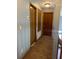 Upper hallway with carpet and two doors at 12512 Belrose Ave, Orlando, FL 32837