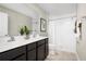 Double vanity bathroom with a large shower and white tile at 1653 Laia Rd, Haines City, FL 33844