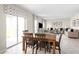 Open dining area with wooden table and chairs, adjacent to kitchen and living room at 1653 Laia Rd, Haines City, FL 33844