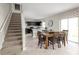 Open dining area with wooden table and chairs, adjacent to kitchen and stairs at 1653 Laia Rd, Haines City, FL 33844