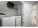 Laundry room with washer, dryer, and shelving at 1653 Laia Rd, Haines City, FL 33844