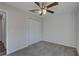 Bright bedroom with ceiling fan and double door closet at 167 Oak Cir, Ocala, FL 34472