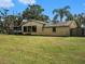 House exterior and backyard view at 1910 E Pollock Rd, Lakeland, FL 33813