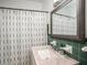 Clean bathroom with a vanity and shower/tub combo at 1910 E Pollock Rd, Lakeland, FL 33813