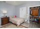 Well-lit bedroom with a queen bed and a large closet at 1910 E Pollock Rd, Lakeland, FL 33813