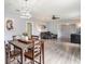 Bright dining area with wood table and chairs, view to living room at 1910 E Pollock Rd, Lakeland, FL 33813