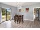 Cozy dining area with a small table and chairs, and view of backyard at 1910 E Pollock Rd, Lakeland, FL 33813
