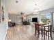 Spacious living and dining area with hardwood floors and lots of natural light at 1910 E Pollock Rd, Lakeland, FL 33813