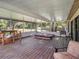 Spacious screened porch with hot tub and backyard access at 1910 E Pollock Rd, Lakeland, FL 33813