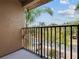 Private balcony overlooking community. Enjoy serene views and fresh air at 216 Calabria Ave, Davenport, FL 33897