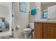 Bathroom with toilet and vanity, adjacent to bedroom at 216 Calabria Ave, Davenport, FL 33897