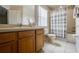 Bathroom with tub, toilet and vanity with storage at 216 Calabria Ave, Davenport, FL 33897