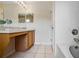 Bathroom with a bathtub, double vanity, and ample storage at 216 Calabria Ave, Davenport, FL 33897