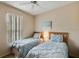 Guest bedroom with two twin-size beds and a ceiling fan at 216 Calabria Ave, Davenport, FL 33897