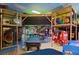 Fun game room with arcade games, pool table, and play area at 216 Calabria Ave, Davenport, FL 33897