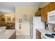 Kitchen with white appliances and ample counter space at 216 Calabria Ave, Davenport, FL 33897