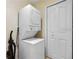 Stackable washer and dryer in laundry closet at 216 Calabria Ave, Davenport, FL 33897