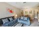 Comfortable living room featuring sofas and a dining area at 216 Calabria Ave, Davenport, FL 33897