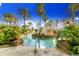 Resort-style pool with a bridge and lush landscaping at 216 Calabria Ave, Davenport, FL 33897