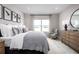 Main bedroom with king size bed and sitting chair at 353 Crestwind Dr, Daytona Beach, FL 32124
