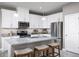 Modern kitchen with white cabinets and stainless steel appliances at 353 Crestwind Dr, Daytona Beach, FL 32124