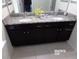 Modern bathroom with double vanity and granite countertop at 5537 Misty Oak Cir, Davenport, FL 33837