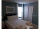Simply styled bedroom with white linens and window at 5537 Misty Oak Cir, Davenport, FL 33837