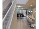 View of the entryway with a staircase leading upstairs and a view of the living room at 5537 Misty Oak Cir, Davenport, FL 33837