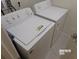 Laundry room equipped with a Whirlpool washer and dryer at 5537 Misty Oak Cir, Davenport, FL 33837
