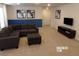 Living room with sectional sofa and blue accent wall at 5537 Misty Oak Cir, Davenport, FL 33837