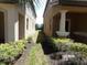 Narrow side yard between two homes with some landscaping at 5537 Misty Oak Cir, Davenport, FL 33837