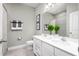 Clean bathroom with a double vanity and shower at 10865 Sw 73Rd Ct, Ocala, FL 34476