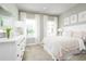 Light and airy bedroom with a queen-size bed and plenty of natural light at 10865 Sw 73Rd Ct, Ocala, FL 34476