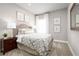 Cozy bedroom with a full-size bed and neutral decor at 10865 Sw 73Rd Ct, Ocala, FL 34476