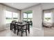 Spacious dining room with large windows and view of a lake at 10865 Sw 73Rd Ct, Ocala, FL 34476