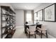 Bright home office features built-in shelving and a workspace with two chairs at 10865 Sw 73Rd Ct, Ocala, FL 34476
