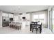 Modern kitchen with white cabinets, stainless steel appliances, and an island at 10865 Sw 73Rd Ct, Ocala, FL 34476