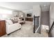Spacious loft area with a comfortable seating area and a TV at 10865 Sw 73Rd Ct, Ocala, FL 34476