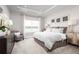 Main bedroom with lake view and cozy sitting area at 10865 Sw 73Rd Ct, Ocala, FL 34476