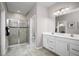 Bathroom with double vanity, shower, and toilet at 10918 Sw 73Rd Ct, Ocala, FL 34476