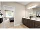 Double vanity bathroom with access to bedroom at 10918 Sw 73Rd Ct, Ocala, FL 34476