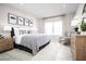 Main bedroom with large bed and sitting area at 10918 Sw 73Rd Ct, Ocala, FL 34476