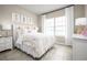 Bedroom with a double bed, nightstands, and window at 10918 Sw 73Rd Ct, Ocala, FL 34476